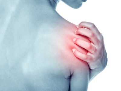 Acute pain in a shoulder at the young women. young girl keeps for a sick shoulder on a white background